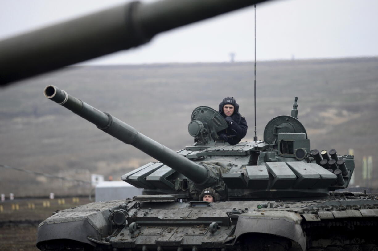 FILE - Russian troops take part in drills at the Kadamovskiy firing range in the Rostov region in southern Russia, Dec. 14, 2021. With the fate of Ukraine and potentially broader post-Cold War European stability at stake, the United States and Russia are holding critical strategic talks that could shape the future of not only their bilateral ties but the relationship between the U.S. and its NATO allies. Prospects are bleak.