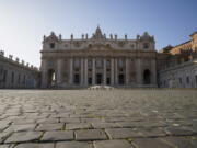 FILE - A view of St. Peter's Basilica at the Vatican, on Nov. 10, 2020. On Tuesday, Nov. 10, 2020. The Vatican said Friday it had completed the sale of a London residential building that is at the heart of a fraud and embezzlement trial under way in the Vatican City State's tribunal, recovering more than it expected from the loss-making investment. The Vatican's economy ministry revealed the sale contract had been signed, and 10% of the deposit received, as it released the Holy See's budget for 2022. It foresees a narrowing of the Holy See's budget deficit to EUR33 million euros from EUR42 million euros last year.