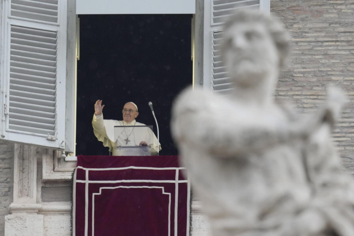 Pope Francis delivers the Angelus noon prayer in St.Peter's Square, at the Vatican, Sunday, Jan. 9, 2022.