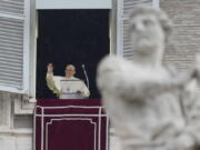 Pope Francis delivers the Angelus noon prayer in St.Peter's Square, at the Vatican, Sunday, Jan. 9, 2022.