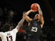 Washington's Terrell Brown Jr. (23) shoots over Oregon State's Dashawn Davis (13) during the first half of an NCAA college basketball game Thursday, Jan. 20, 2022, in Corvallis, Ore.