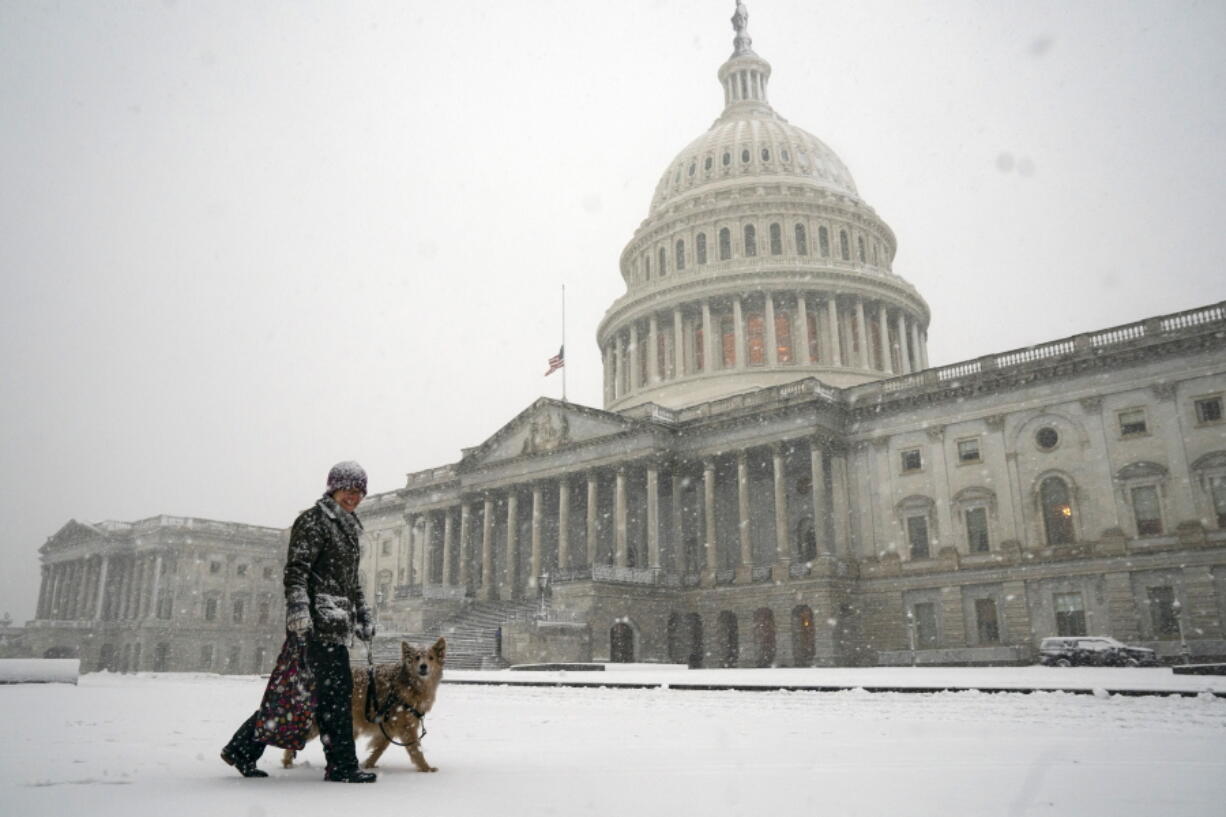 A winter storm delivers heavy snow to the Capitol in Washington, Monday, Jan. 3, 2022. (AP Photo/J.