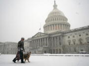 A winter storm delivers heavy snow to the Capitol in Washington, Monday, Jan. 3, 2022. (AP Photo/J.