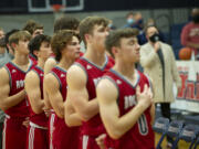 Castle Rock players stand for the national anthem prior to their game at King's Way Christian on Tuesday, Jan.