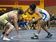 Mountain View's CJ Hamblin (right) wrestles Kelso's Tyler Roggow in the 170-pound championship at the 3A wrestling district tournament.