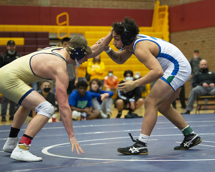 Mountain View's CJ Hamblin (right) wrestles Kelso's Tyler Roggow in the 170-pound championship at the 3A wrestling district tournament.