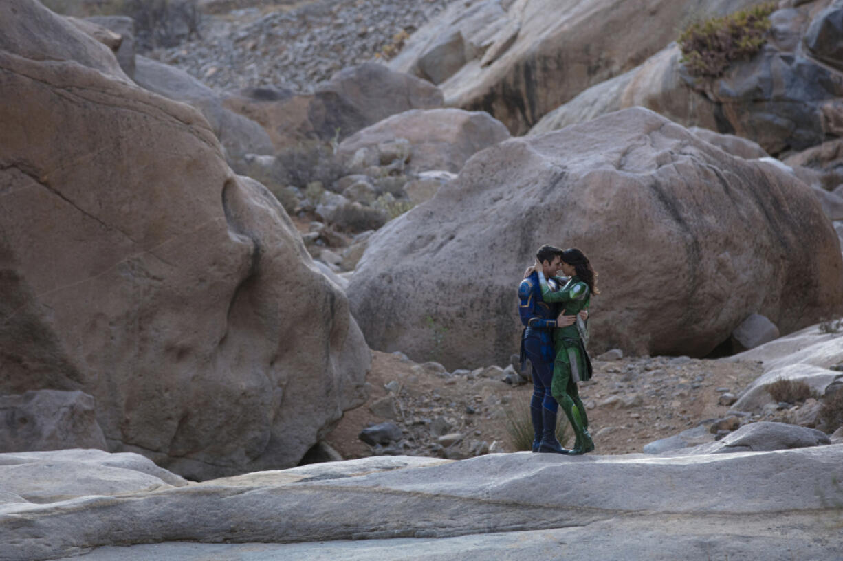 Richard Madden, left, and Gemma Chan in the film "Eternals." (Sophie Mutevelian/Marvel Studios/TNS)