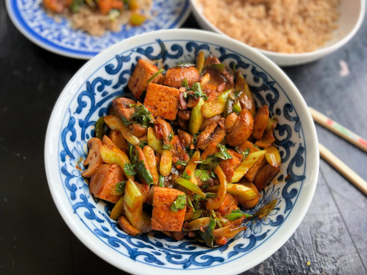 This quick and easy tofu stir-fry features colorful vegetables and a spicy chili garlic sauce.