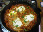 Shakshuka is spicy stewed tomatoes topped with eggs.