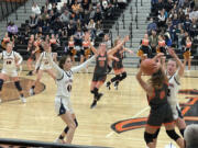 Ellensburg defenders pressure Washougal during the second half of the 2A girls basketball regional on Saturday in Yakima.