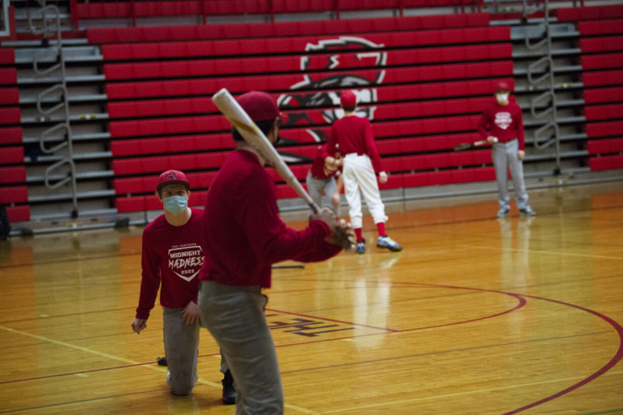 The Fort Vancouver baseball team runs through drills during their midnight practice on Feb.