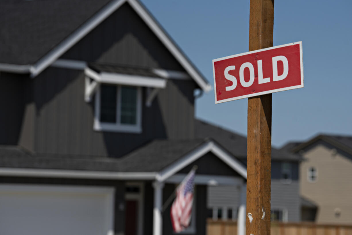 A sign outside a new home at Kennedy Farm lets homebuyers know the property's status in Ridgefield.