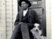 George Washington sits in front of one of his homes in Centralia, a city he co-founded with his wife, Mary Jane. Both had African American ancestors. The couple platted the land at the midpoint on the Northern Pacific Railway between Kalama and Tacoma for a town they named Centerville (now Centralia).