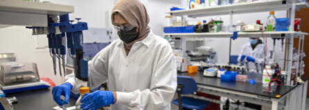 Riffat Ahmed checks the quality of samples in Capsigen's downtown Vancouver lab. At top, AAV capsids have the potential to deliver gene therapy tools directly to specific cells to cure diseases that currently have no cure.