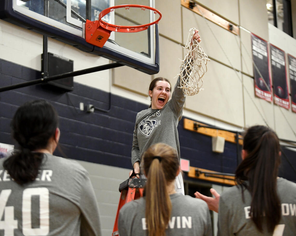 King’s Way senior Laurel Quinn lets out a yell after cutting down the net Friday, Feb. 4, 2022, after the Knights’ 45-40 win against the Wildcats at King’s Way Christian High School. King’s Way became the Trico League co-champion after the win.