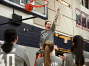 King’s Way senior Laurel Quinn lets out a yell after cutting down the net Friday, Feb. 4, 2022, after the Knights’ 45-40 win against the Wildcats at King’s Way Christian High School. King’s Way became the Trico League co-champion after the win.
