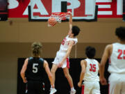 Camas' Stephen Behil throws down a first-half slam against Union in the 4A Greater St. Helens League regular-season finale on Tuesday. Camas won 80-77 to force a tiebreaker game Wednesday.