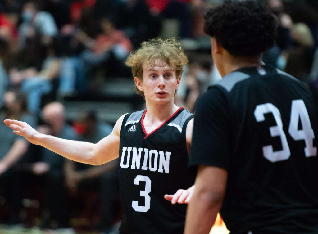 Union's Bryson Metz, shown here during Tuesday's game against Camas, poured in 18 second-half points to help lift the Titans to a 74-52 victory in Wednesday's tiebreaker game against Camas.(Joshua Hart/For The Columbian)