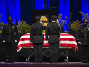 Law enforcement officers pay tribute to Officer Donald Sahota at ilani Casino Resort on Tuesday afternoon, Feb. 8, 2022. Sahota, 52, was mistakenly shot at his home near Battle Ground by a Clark County sheriff during a manhunt for a robbery suspect.