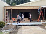 Workers begin construction on a state-of-the-art music facility at Meadow Glade Adventist Elementary School, a 125-year-old school in Battle Ground. The school received a $400,000 grant from the M.J. Murdock Charitable Trust to help fund the project.