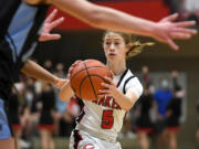 Camas sophomore Parker Mairs fakes a pass Friday, Feb. 11, 2022, during the Papermakers’ 65-34 win against Rogers-Puyallup at Camas High School.