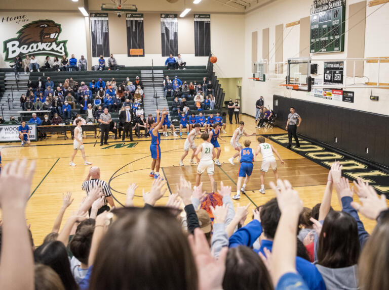 Students urge on Ridgefield junior Sid Bryant during a free throw Tuesday, Feb. 15, 2022, during the Spudders’ 51-46 loss to Tumwater at Woodland High School.