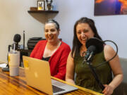 Meredith Pena, left, and Deanna Berger laugh at Pena's house in Orchards. Despite not having prior podcasting experience, the two women felt passionate and inspired to share their journey through breast cancer diagnosis with others. When they first started, they both spoke into a single microphone. "We kind of learned as we went, and our sound quality gets better as we go," Pena said.