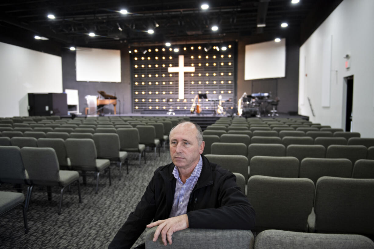 Paul Demyanik, pastor at Ukrainian Baptist Church, pauses for a portrait in his church's sanctuary in northeast Vancouver. He fears for those in his homeland if Russia takes over the country.