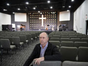 Paul Demyanik, pastor at Ukrainian Baptist Church, pauses for a portrait in his church's sanctuary in northeast Vancouver. He fears for those in his homeland if Russia takes over the country.