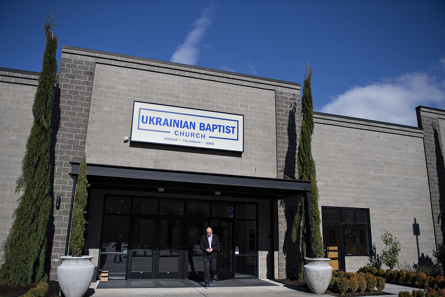 Paul Demanyik, pastor at Ukrainian Baptist Church, walks out the front doors of the church in northeast Vancouver on Feb. 22. Demanyik is among those who are closely watching the situation at the border of Ukraine and Russia.