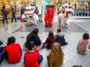 White Lotus group performs a lion dance Saturday at Vancouver Mall to celebrate Lunar New Year. Lion dances are performed to chase away evil spirits and welcome prosperity and luck for the new year. (Molly J.