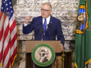 Washington Gov. Jay Inslee speaks as he gives his annual State of the State address, Tuesday, Jan. 11, 2022, at the Capitol in Olympia, Wash. Due to cautions against COVID-19, Inslee gave his speech in the State Reception Room and it was shown by streaming video to lawmakers meeting remotely. (AP Photo/Ted S.