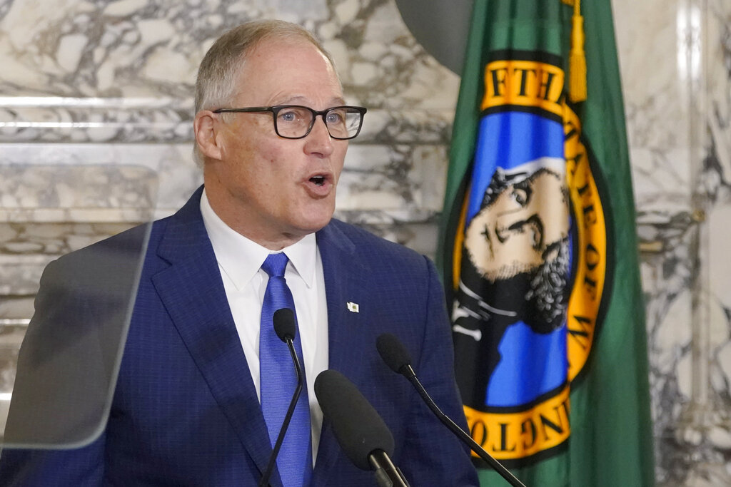 Washington Gov. Jay Inslee speaks as he gives his annual State of the State address, Tuesday, Jan. 11, 2022, at the Capitol in Olympia, Wash. Due to cautions against COVID-19, Inslee gave his speech in the State Reception Room and it was shown by streaming video to lawmakers meeting remotely. (AP Photo/Ted S.