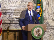 Washington Gov. Jay Inslee speaks as he gives his annual State of the State address, Tuesday, Jan. 11, 2022, at the Capitol in Olympia, Wash. Due to cautions against COVID-19, Inslee gave his speech in the State Reception Room and it was shown by streaming video to lawmakers meeting remotely. (AP Photo/Ted S.