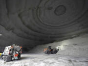 A City of Chicago Department of Streets and Sanitation salt truck waits for a load in a city salt dome in anticipation of a winter storm Tuesday, Feb. 1, 2022, in Chicago. A major winter storm is expected to affect a huge swath of the United States beginning Tuesday, with heavy snow starting in the Rockies and freezing rain as far south as Texas before it drops snow and ice on the Midwest.