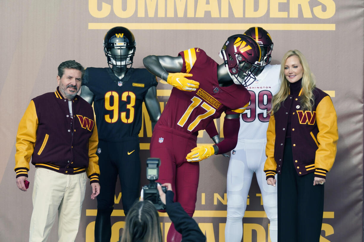 Dan and Tanya Snyder, co-owners and co-CEOs of the Washington Commanders, unveil their NFL football team's new identity, Wednesday, Feb. 2, 2022, in Landover, Md. The new name comes 18 months after the once-storied franchise dropped its old moniker following decades of criticism that it was offensive to Native Americans.