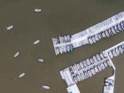 Boats are covered with ice and snow at White Rock Lake, Thursday, Feb. 3, 2022, in Dallas. More than 200,000 homes and businesses lost power across the U.S.