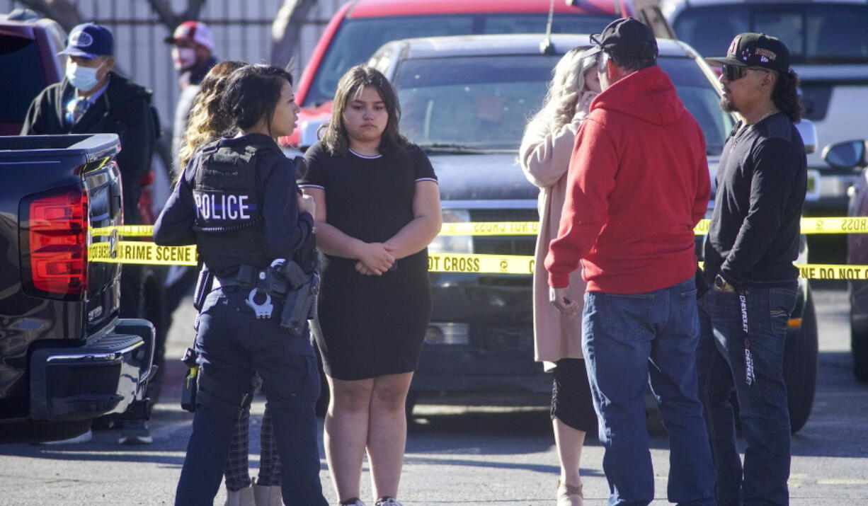 Albuquerque Police crime talk with bystanders after multiple people were stabbed near Central and Wyoming NE on Sunday, Feb. 13, 2022.