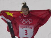 Silver medal winner China's Eileen Gu celebrates during the venue award ceremony for the women's slopestyle finals Tuesday in Zhangjiakou, China.