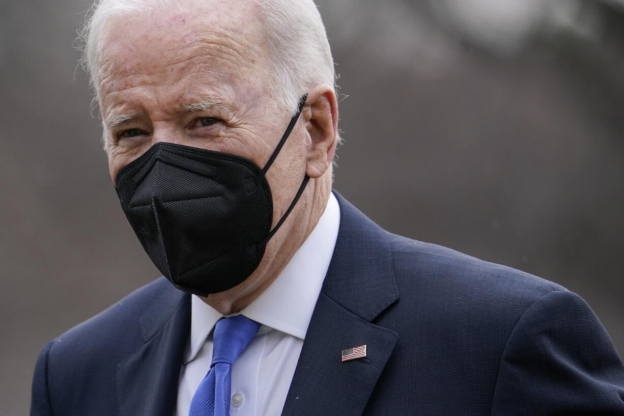 President Joe Biden walks on the South Lawn of the White House after stepping off Marine One, Monday, Feb. 14, 2022, in Washington. Biden is returning to Washington after spending the weekend at Camp David.