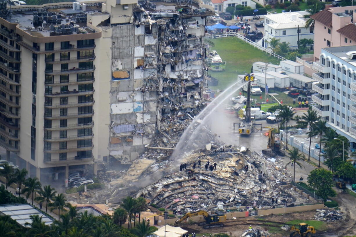 Rescue personnel work June 25 at the remains of the Champlain Towers South condo building in Surfside, Fla.