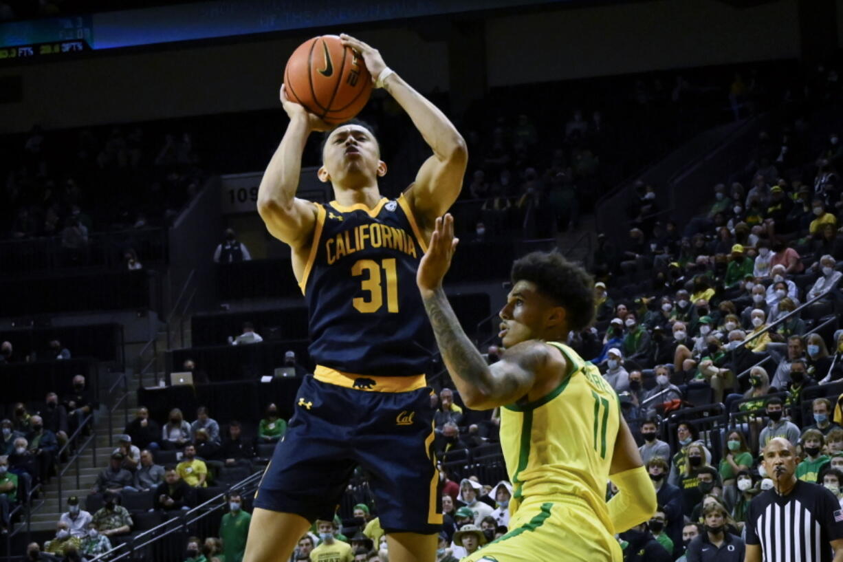 California guard Jordan Shepherd (31) shoots over Oregon guard Rivaldo Soares (11) during the second half of an NCAA college basketball game Saturday, Feb. 12, 2022, in Eugene, Ore.