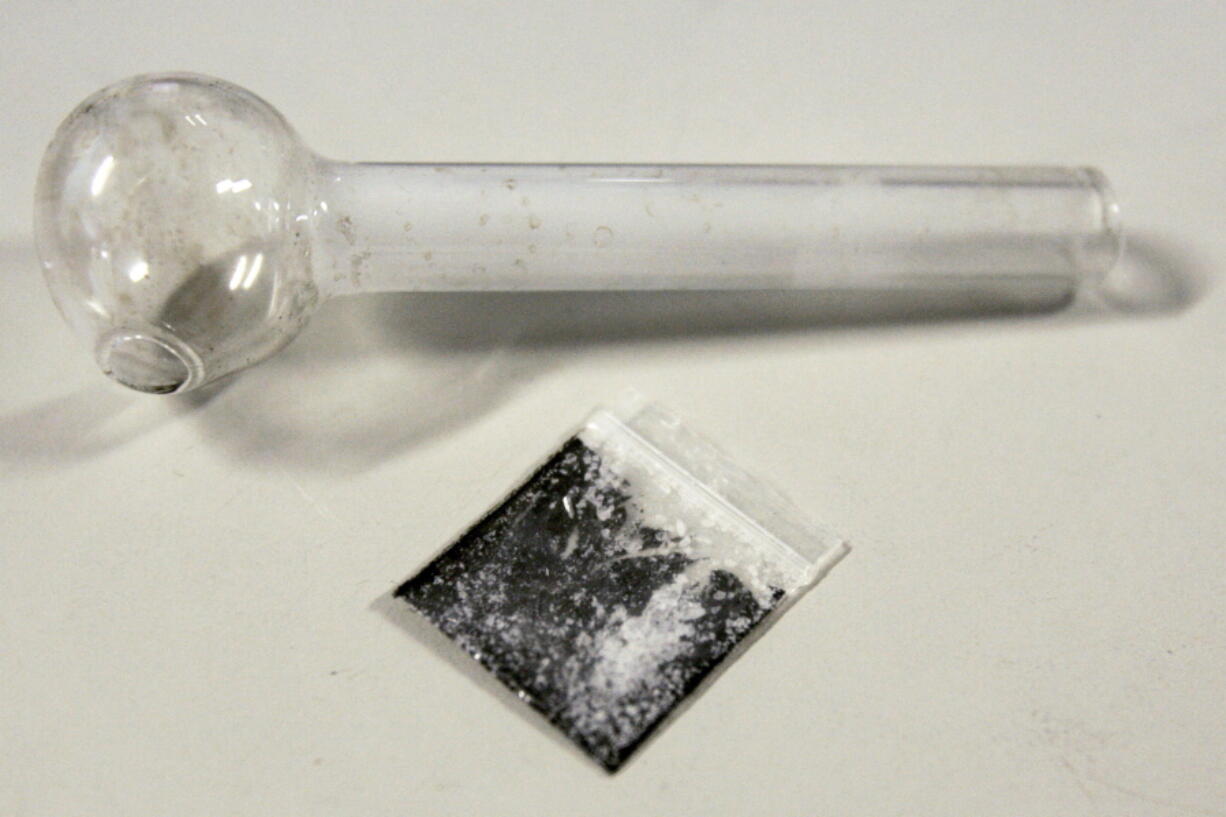 FILE - A pouch containing crystalized methamphetamine and a homemade pipe are shown March 21, 2006, in Window Rock, Ariz. Following outrage on the political right, the Biden administration said Wednesday that a grant program to help prevent additional harm to people who use illicit drugs will not pay for safer pipes to smoke crack or meth.