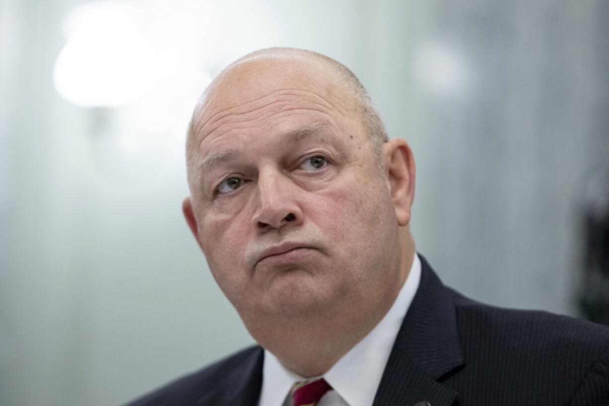 FILE - FAA Administrator Steve Dickson listens to question from lawmakers during a Senate Committee on Commerce, Science, and Transportation hearing on the implementation of aviation safety reform at the Capitol in Washington, on Nov. 3, 2021.