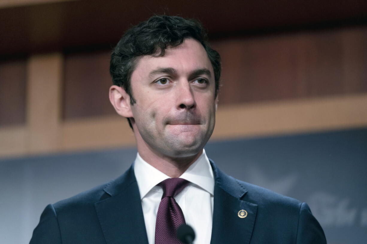 FILE - Sen. Jon Ossoff, D-Ga., takes a question from a reporter during a news conference on Capitol Hill in Washington, Sept. 28, 2021. The U.S. Senate is launching a bipartisan working group of lawmakers to scrutinize conditions within the federal Bureau of Prisons in the wake of Associated Press reporting that uncovered widespread corruption and abuse in federal prisons across the U.S. The working group is led by Sen. Jon Ossoff, a Democrat from Georgia and Sen. Mike Braun, an Indiana Republican.