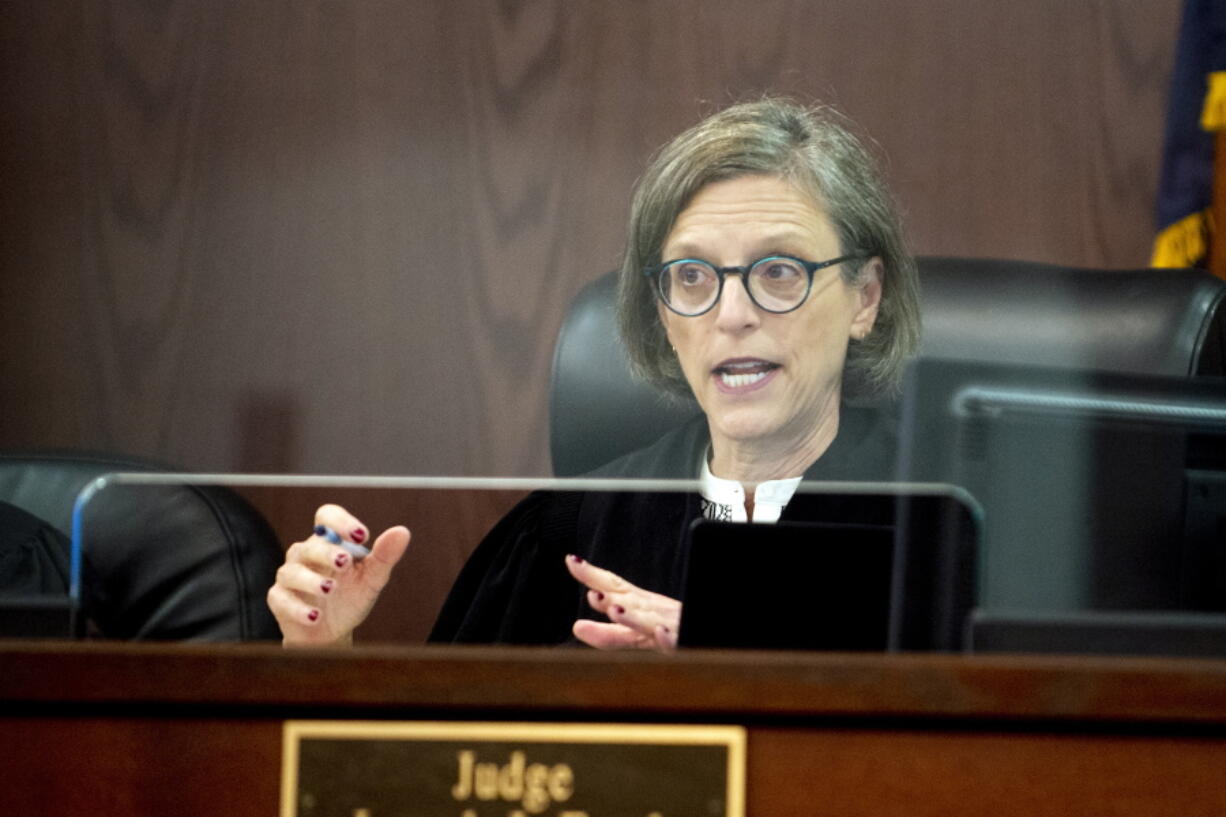 FILE - U.S. District Judge Judith Levy speaks as she address one of 15 Flint residents objecting to the $641-million Flint water crisis settlement at Genesee County Circuit Court, Tuesday, July 13, 2021 in Flint, Mich. Jury selection starts Tuesday, Feb. 15, 2022, in a trial to determine if engineering contractors bear responsibility for lead-contaminated water in Flint.