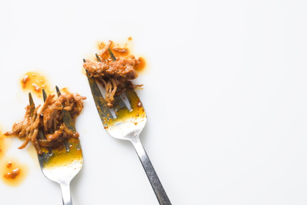 This image released by Milk Street shows a recipe for Miso-Gochujang Shredded Pork.