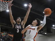 Gonzaga guard Andrew Nembhard (3) defends against Pepperdine guard Mike Mitchell Jr. (1) during the first half of an NCAA college basketball game Wednesday, Feb. 16, 2022, in Malibu, Calif.