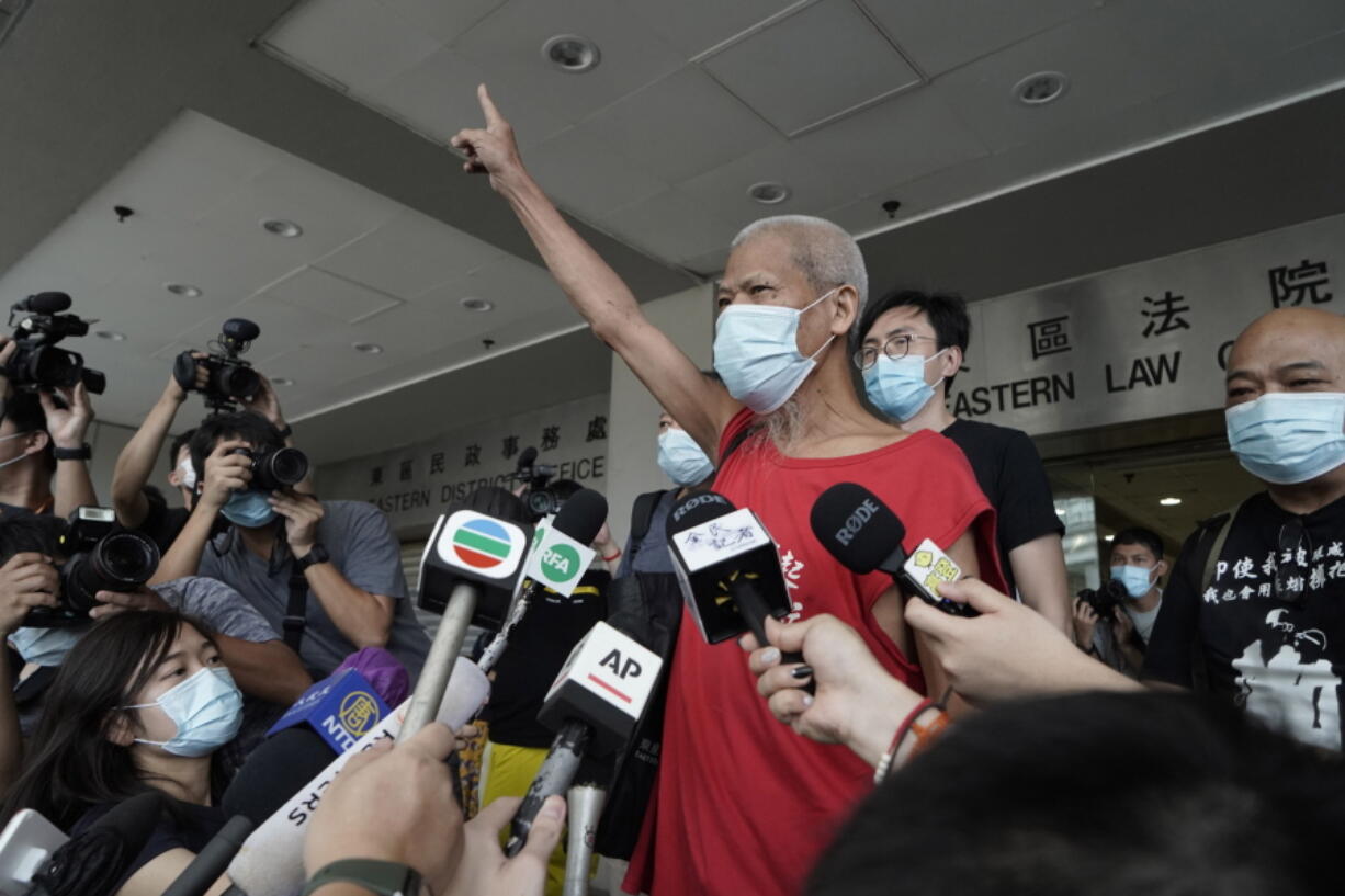 FILE - Hong Kong activist Koo Sze-yiu speaks to the media after arriving at a court in Hong Kong, Sept. 30, 2020. Koo Sze-yiu was arrested Friday, Feb. 4, 2022, days after he announced plans to protest the Beijing Winter Olympics outside government offices in the city, according to local media.