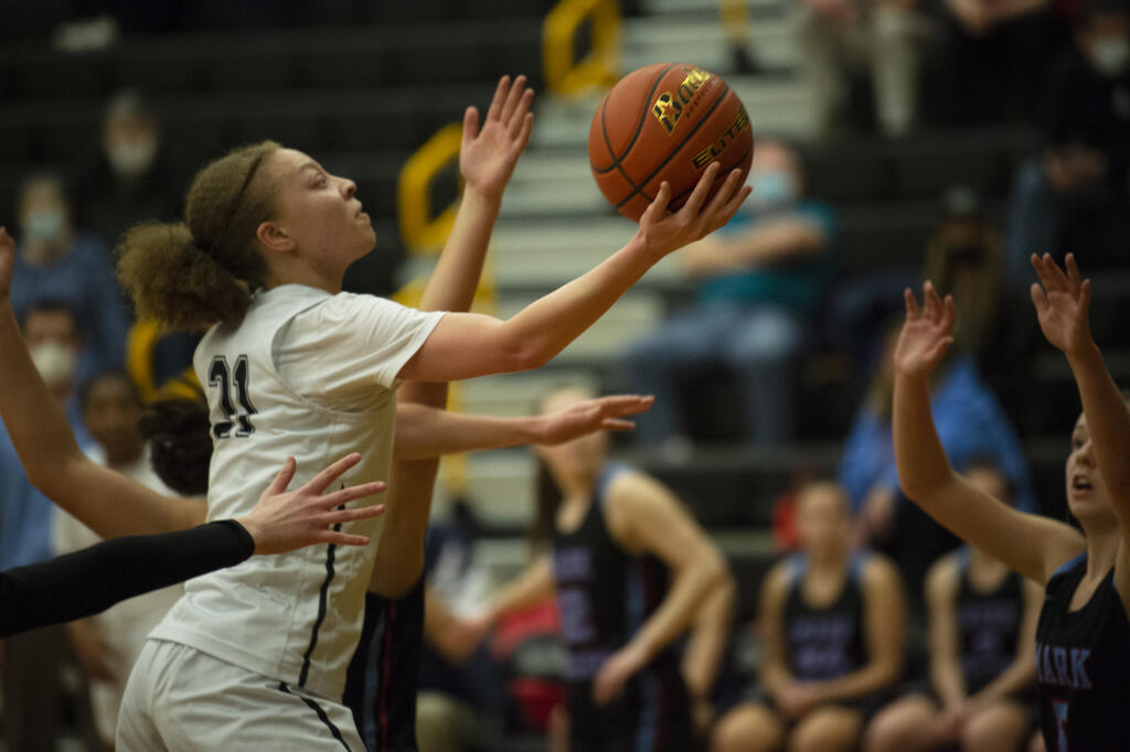 Paytin Ballard of Hudson's Bay drives to the basket during a 2A district tournament girls basketball game against Mark Morris (Tim Martinez/The Columbian)